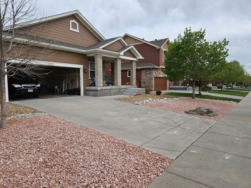 A house with a car parked in front of it