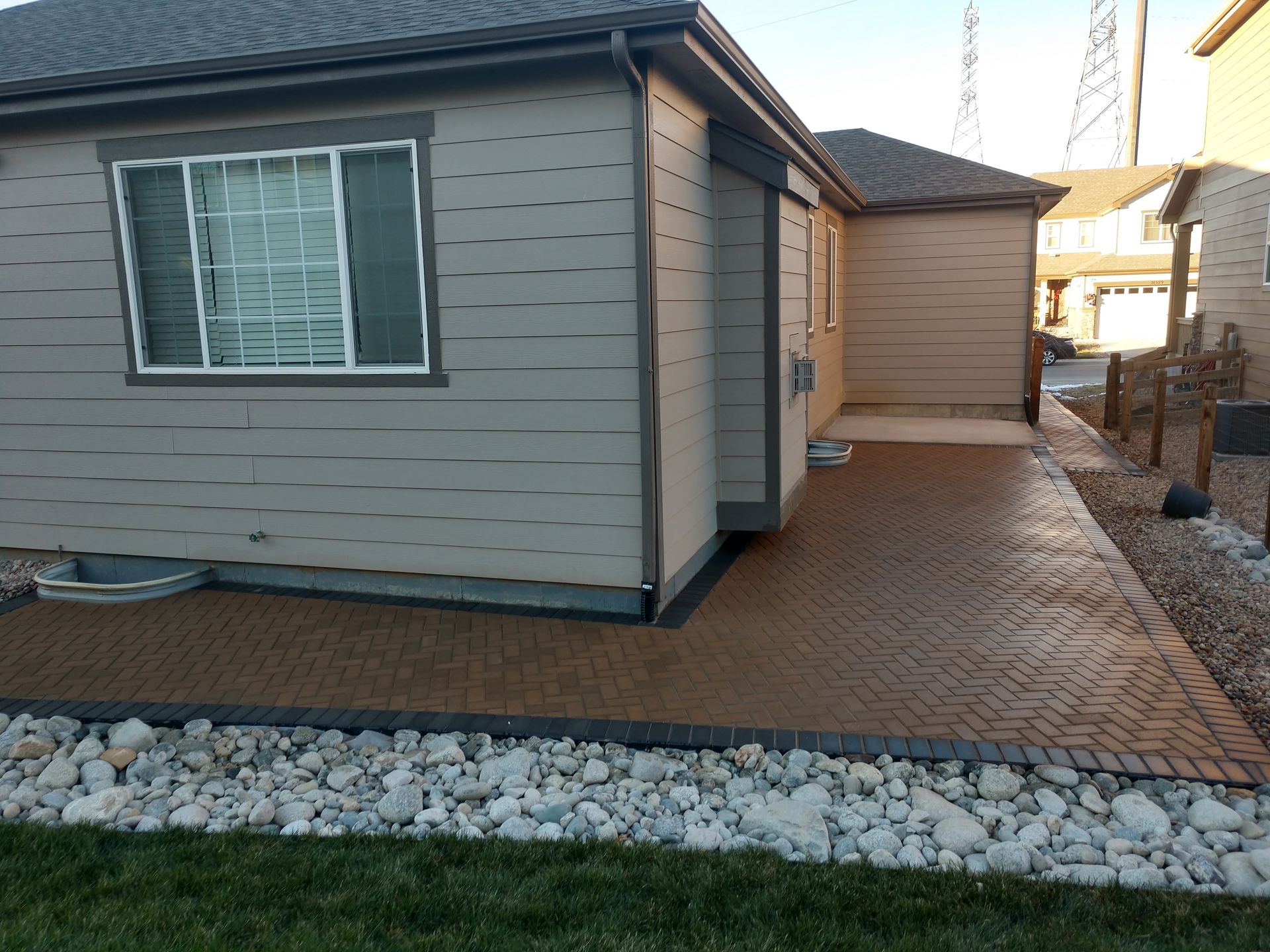 A house with a concrete walkway leading to it