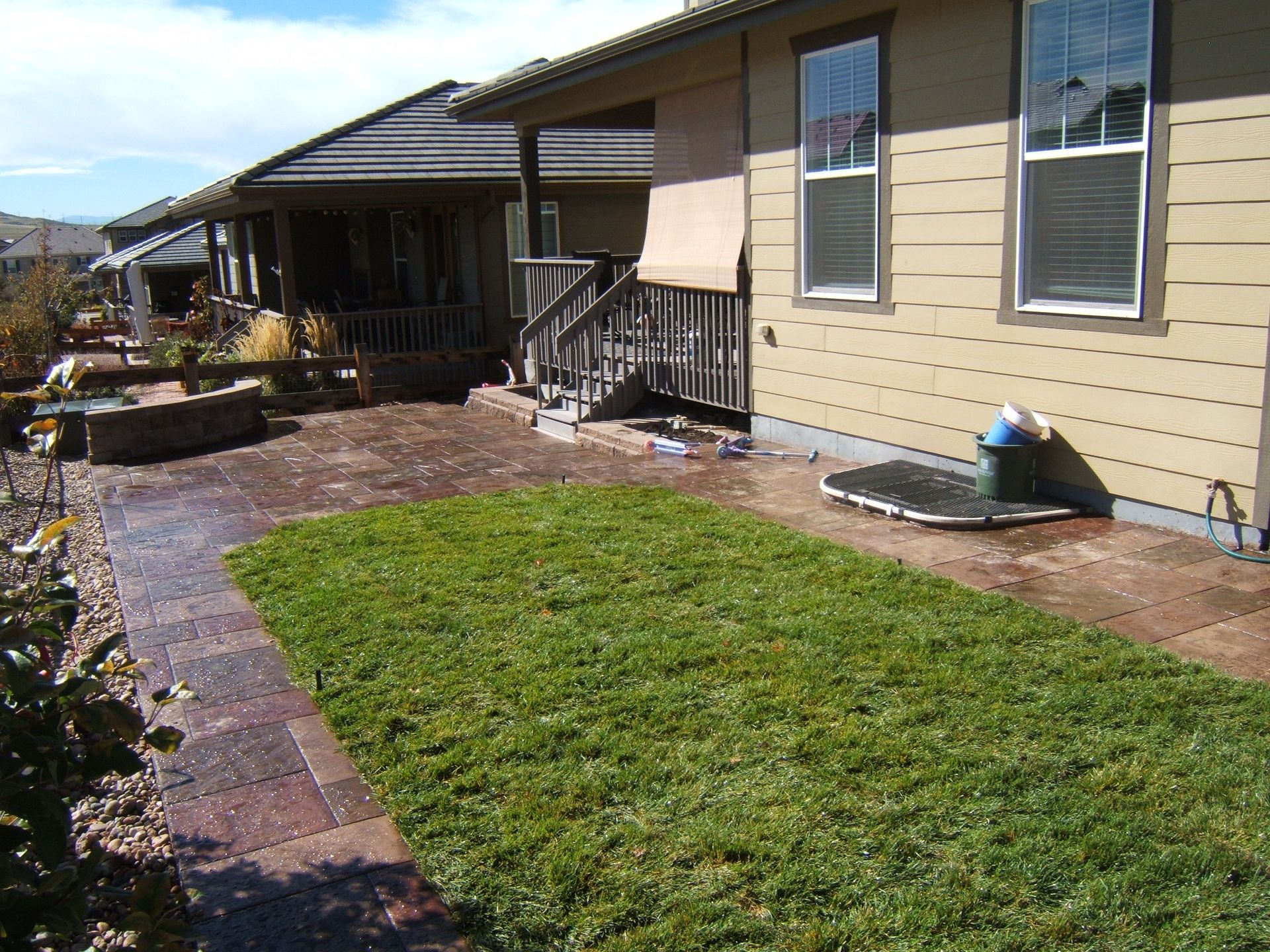 A house with a large lawn in front of it