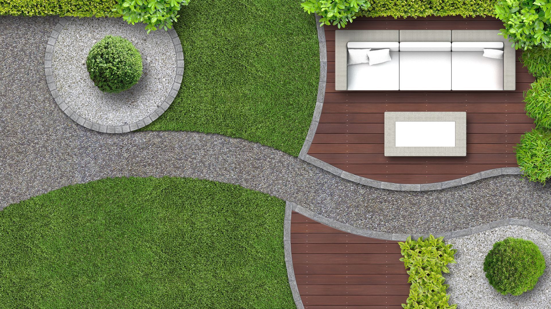 An aerial view of a garden with a couch and a table.