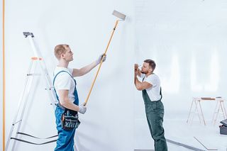 Two Men Painting and Measuring Walls — Lonsdale, MN — Engelking Coatings