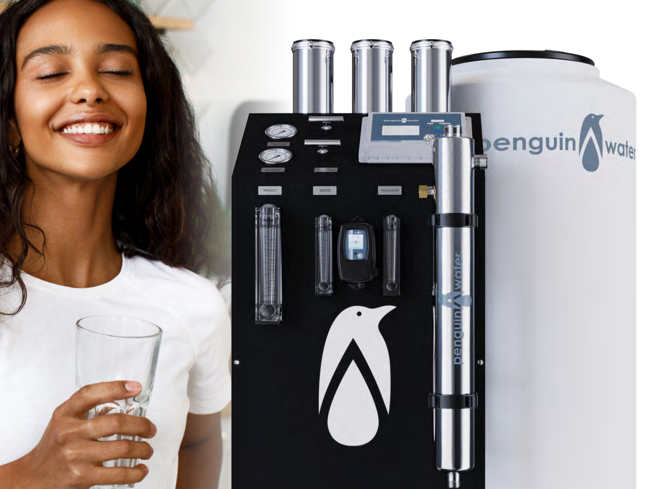 A woman is holding a glass of water next to a penguin water machine.