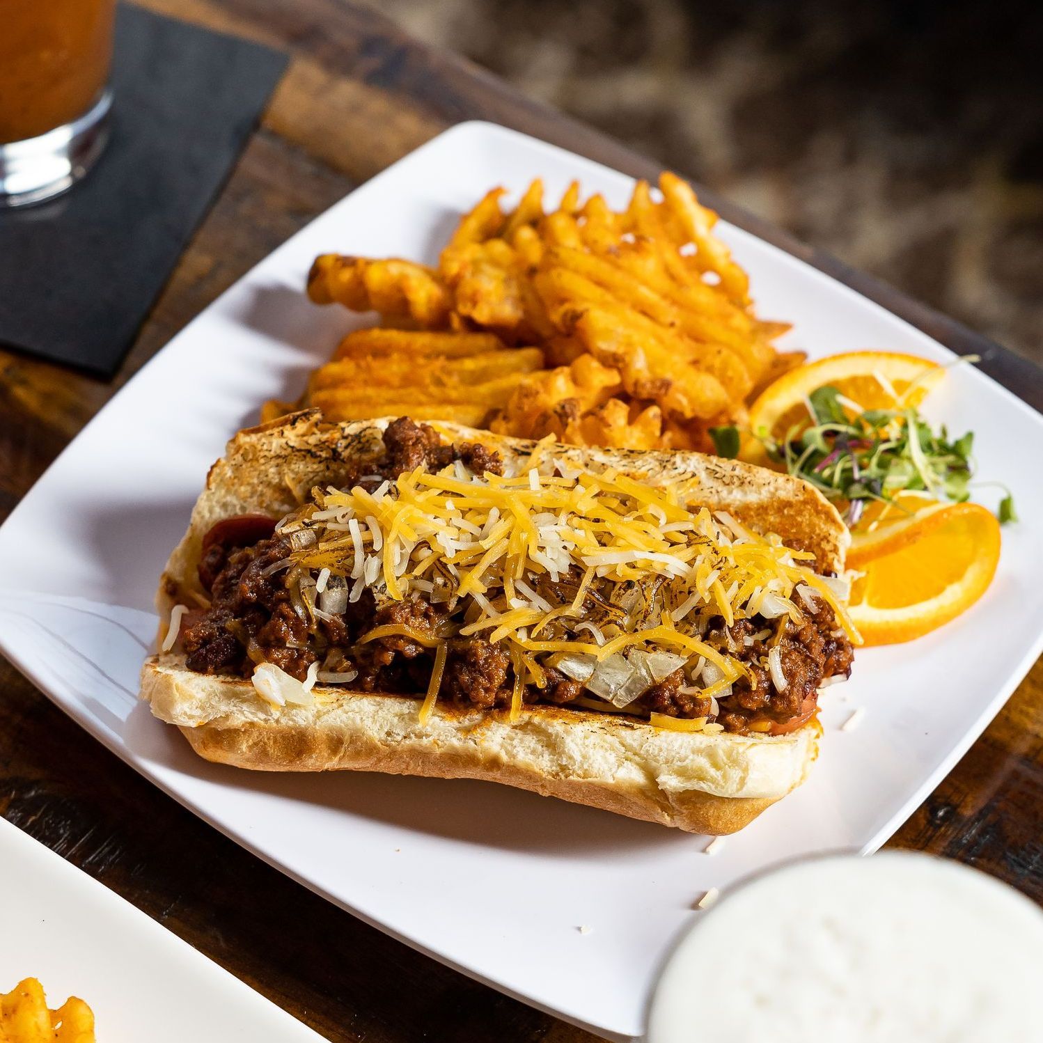 large sandwich with waffle fries from Tony Tenderonis in Denver Colorado near Coors Field