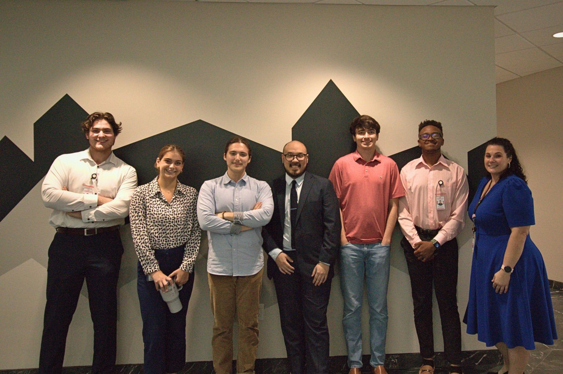 Interns standing in front of workshop screen