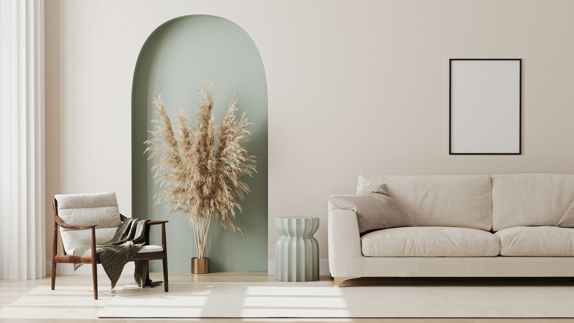 Neutral-toned living room with beige sofa, wooden chair, pampas grass, and mint-colored archway.