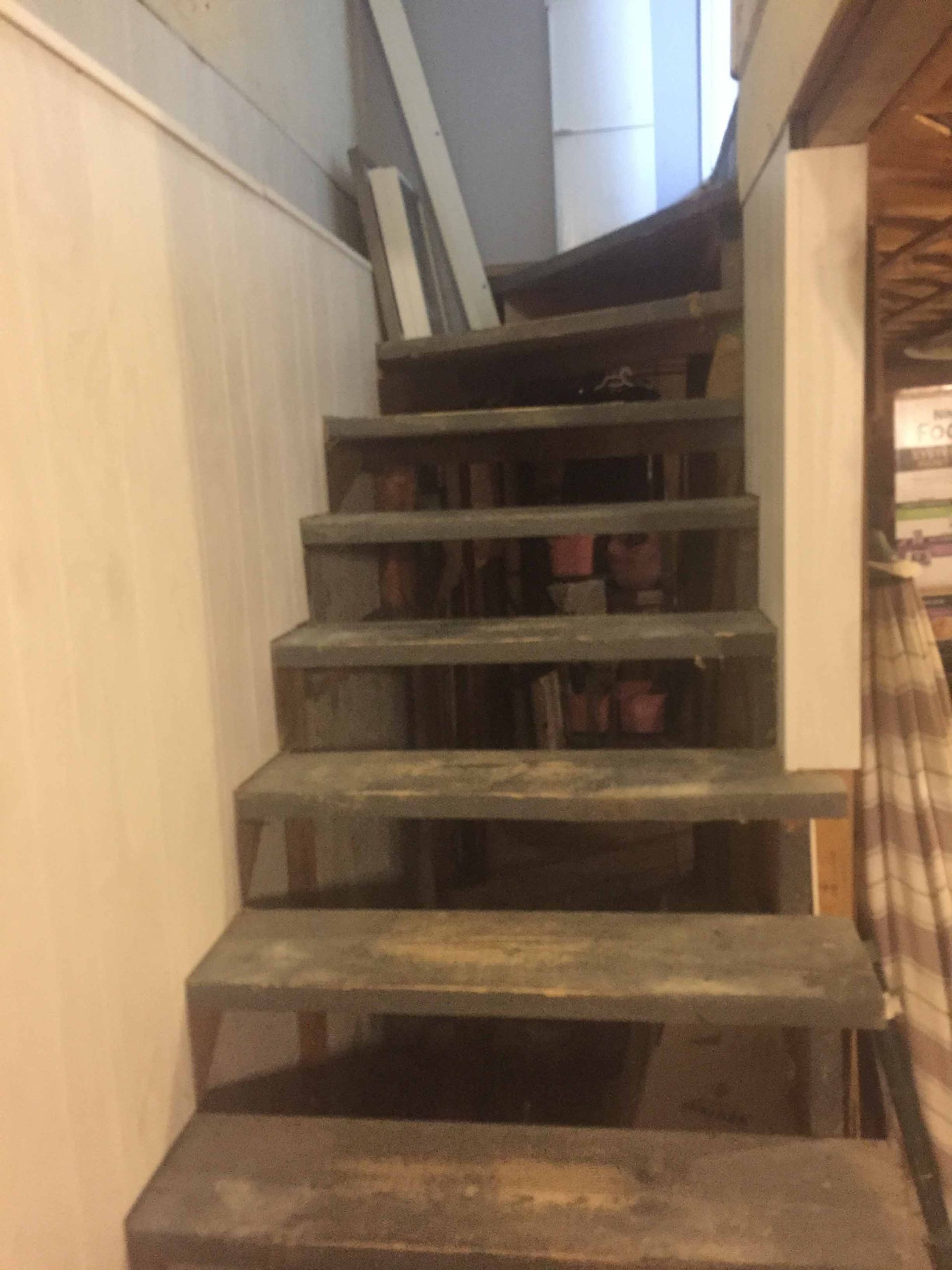 A set of stairs leading up to the second floor of a building.