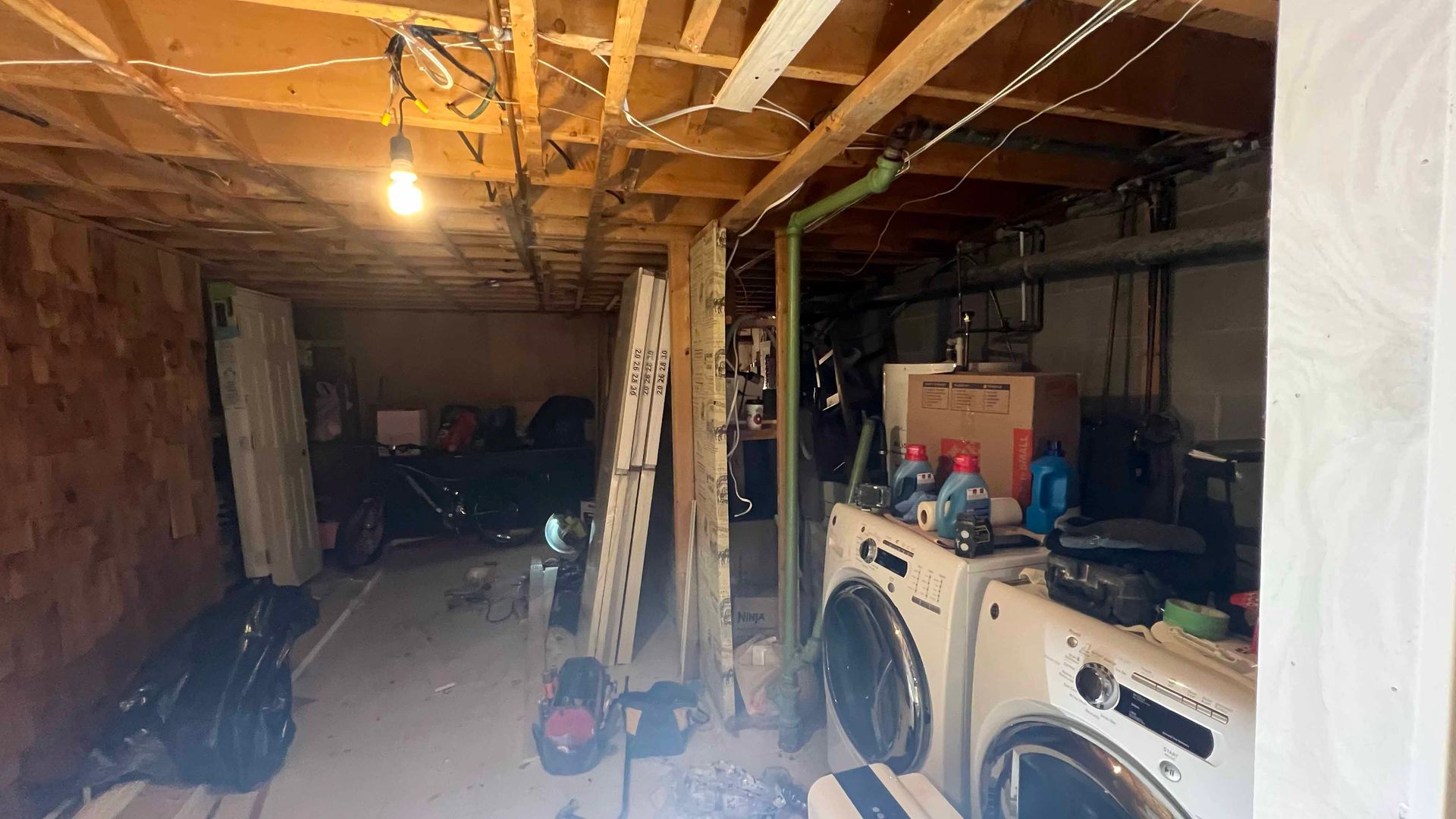 A laundry room with a washer and dryer in it.
