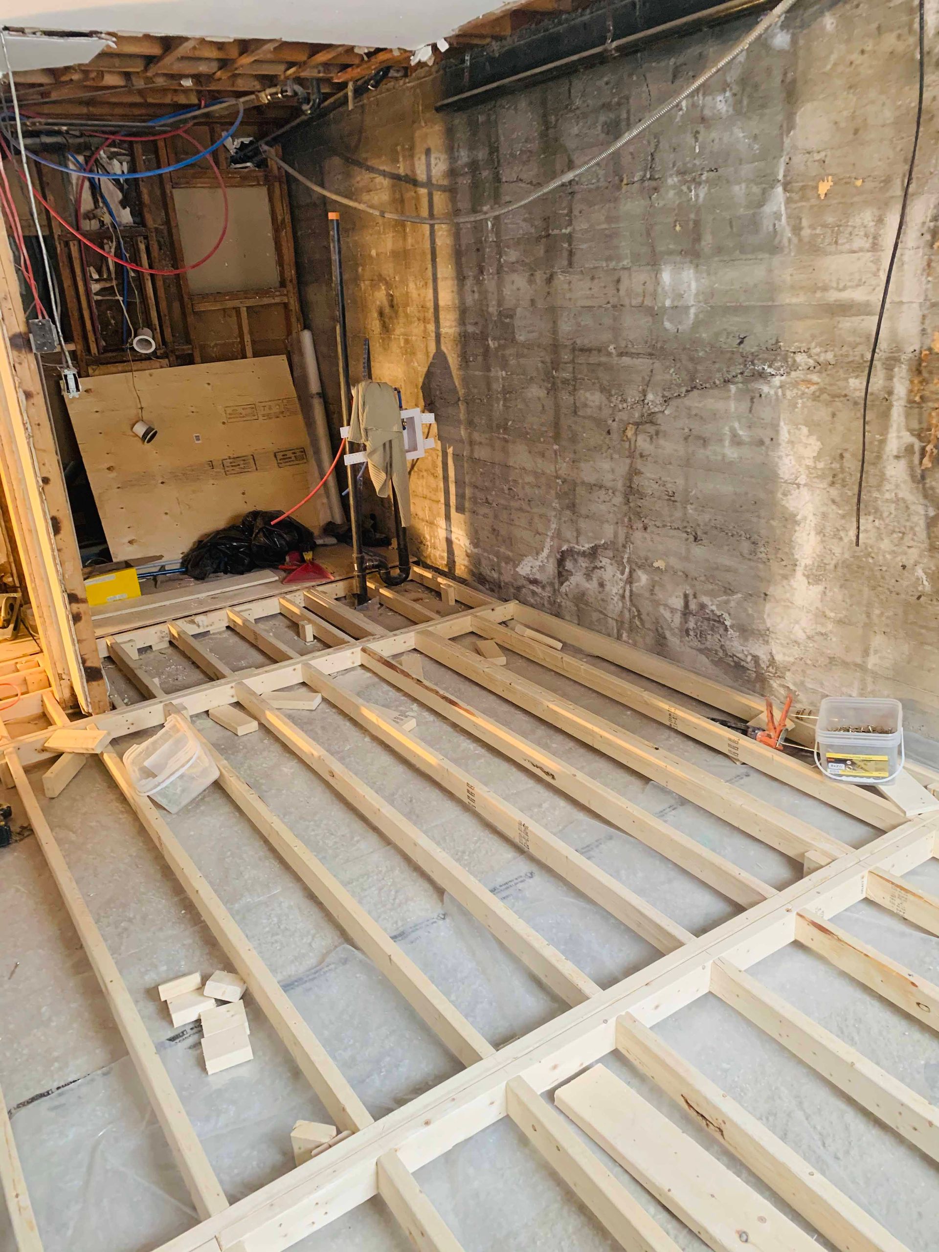 A wooden floor is being built in a room.