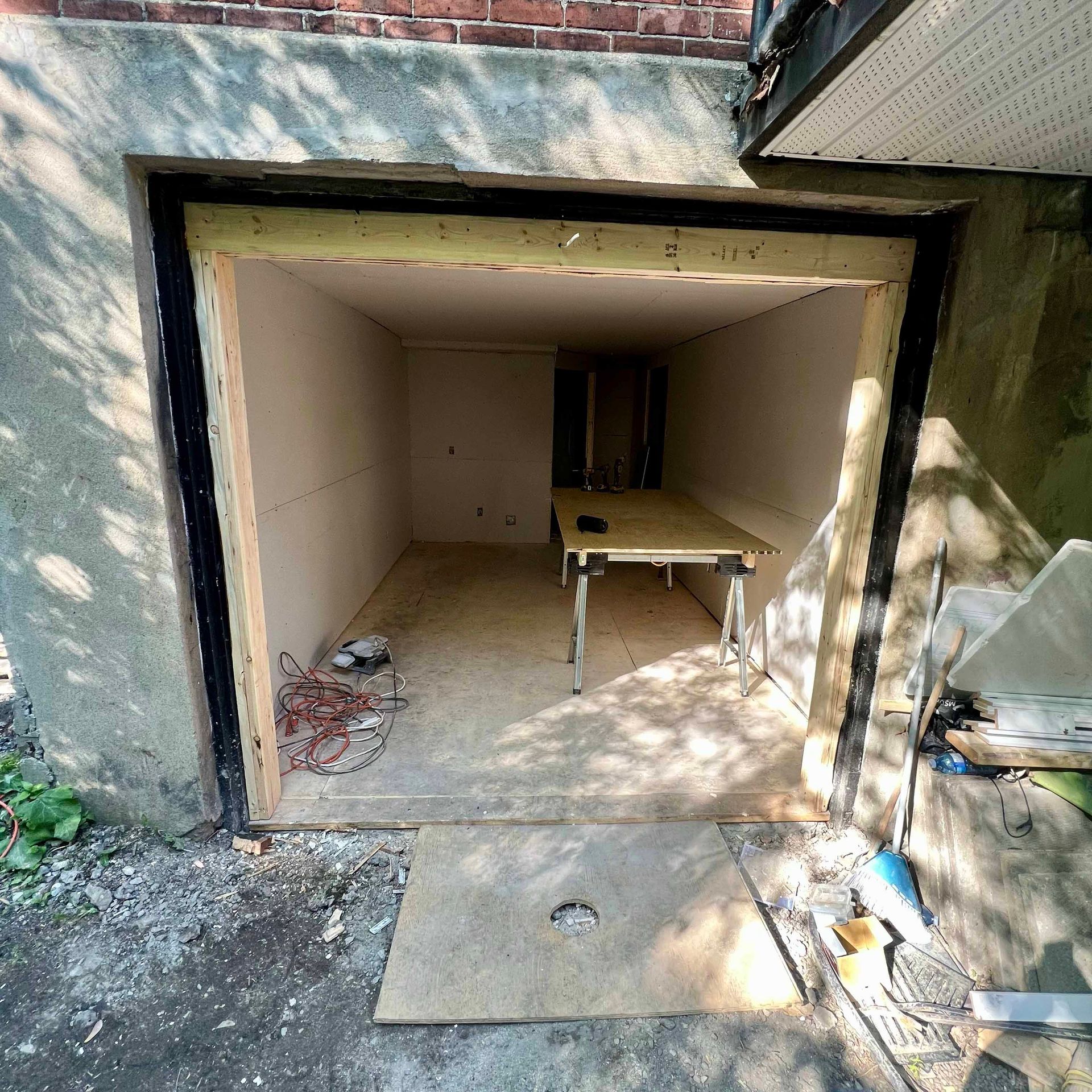 An empty garage with a table inside of it