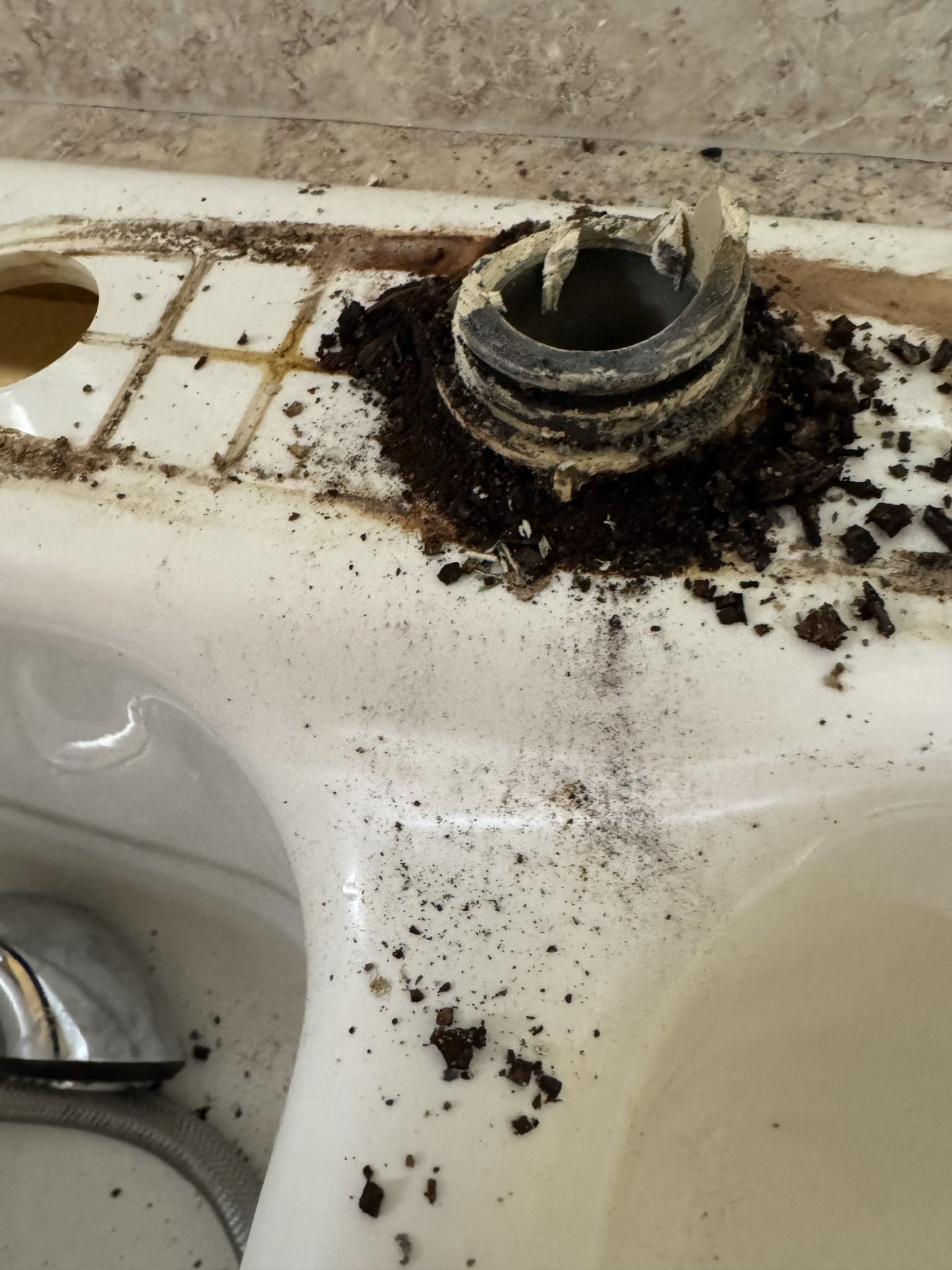 A close up of a bathroom sink with a hole in it