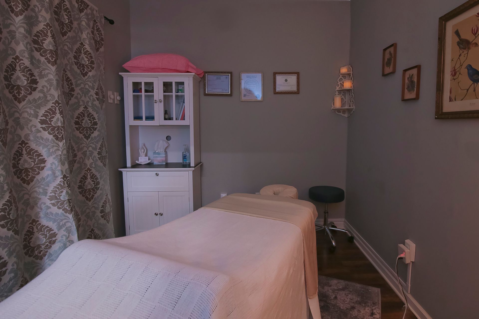 A woman is getting her hair dyed by a hairdresser in a salon.