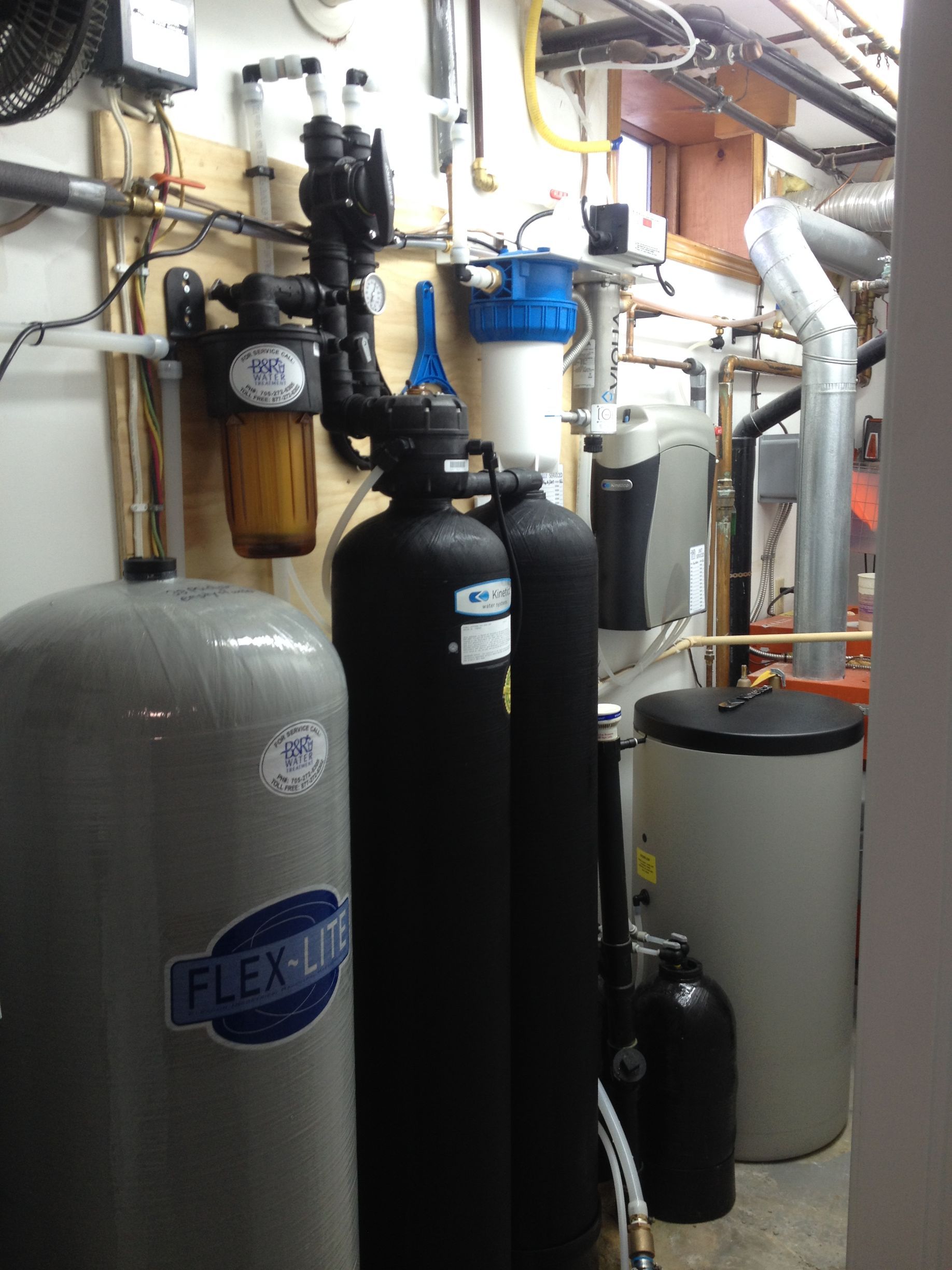 A flexon water filter is sitting in a room