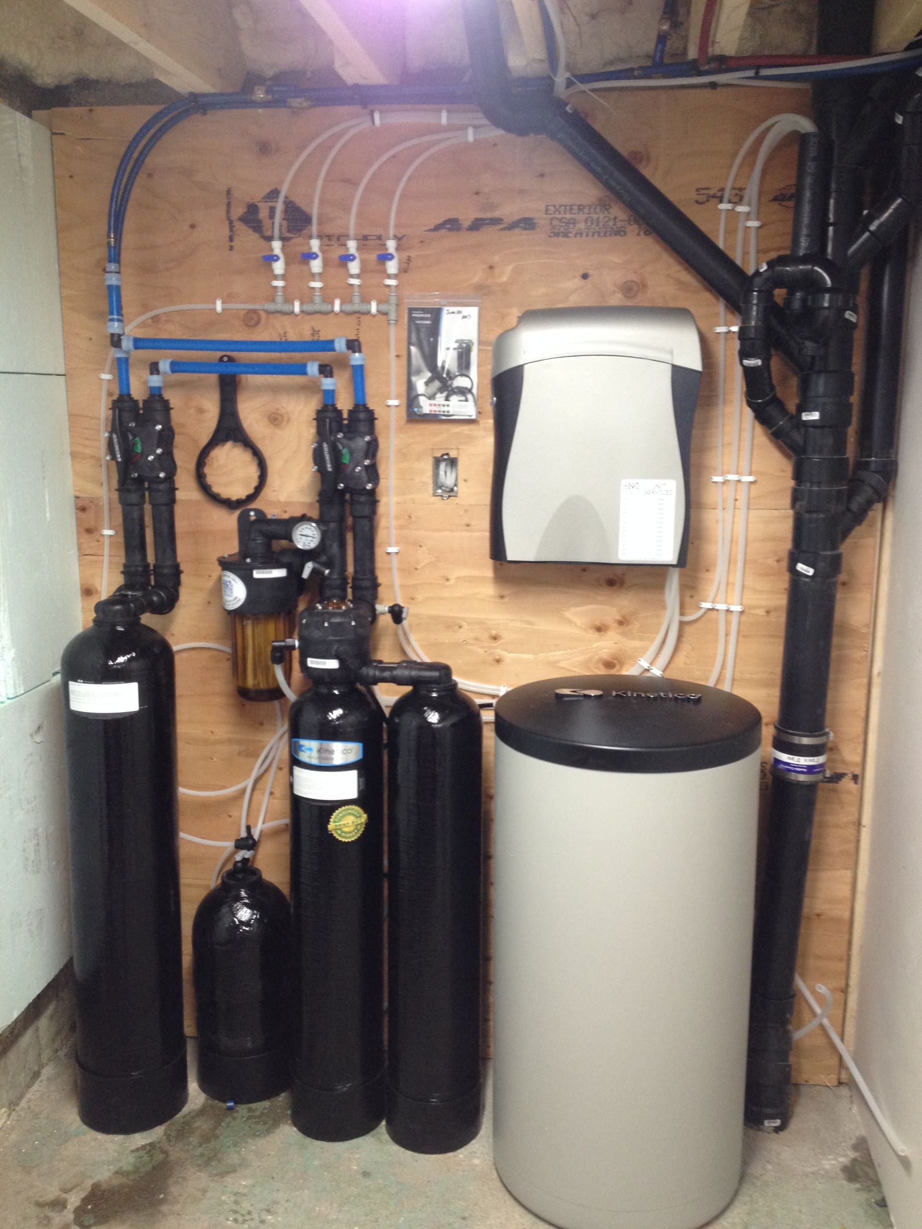 A water treatment system is installed in a basement