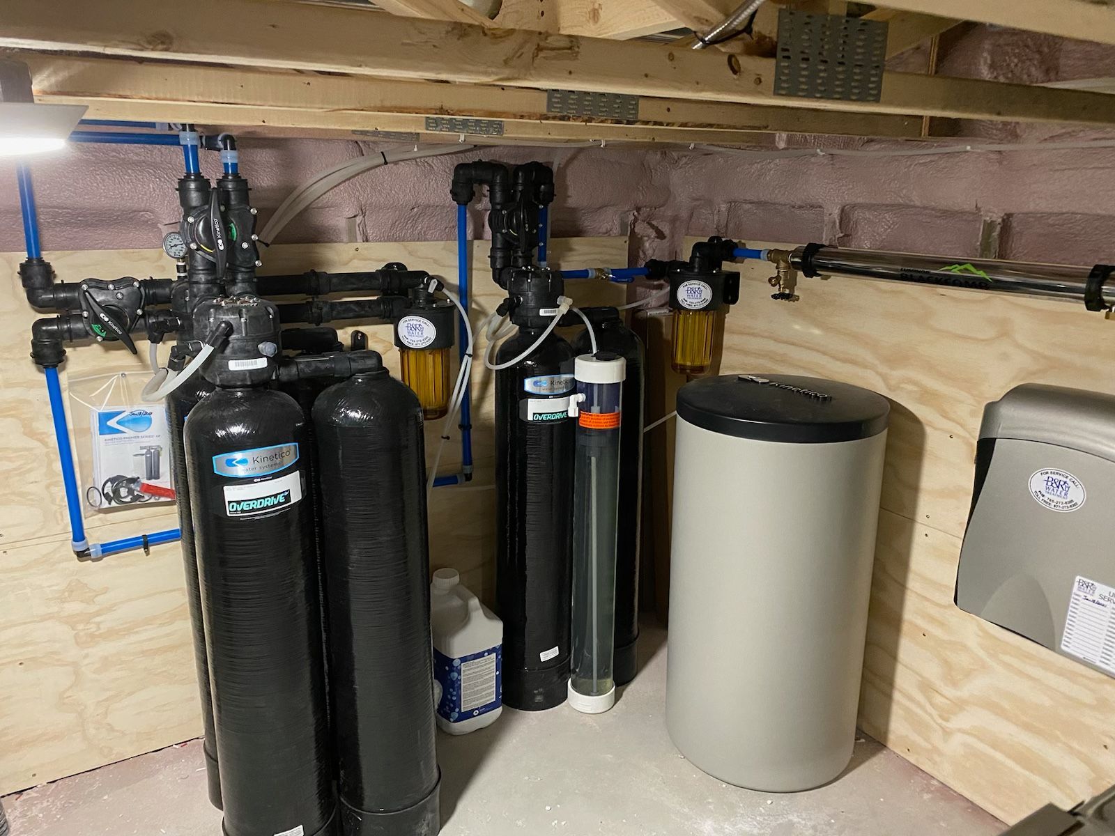 A room with a lot of water treatment equipment in it.