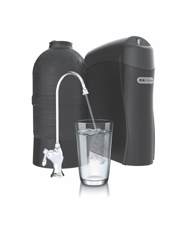 A water filter is pouring water into a glass.