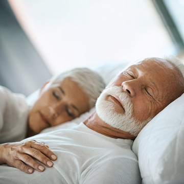elderly couple sleeping peacefully