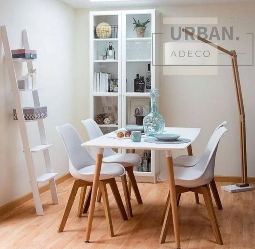 Un comedor con una mesa y sillas y un cartel que dice urban adeco.
