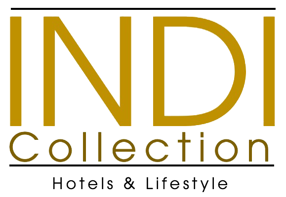 Logo of Conchigliazzurra Resort & Beach, a seashell above the words, in gray.