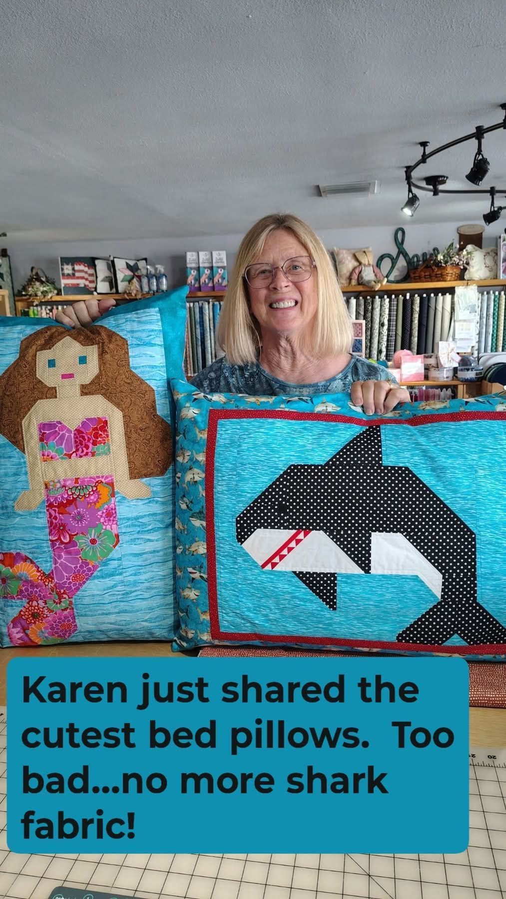 Woman holding two handmade bed pillows: a doll and a shark, with text overlay about sharing the shark fabric.