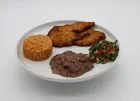 Plate of food: breaded meat, rice, refried beans, and salsa.