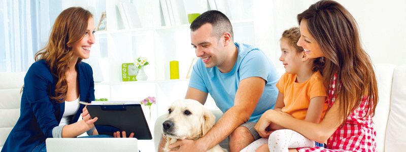 family-discussing-with-professional-in-living-room