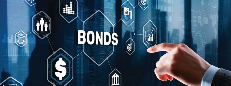 a person is pointing at a screen with the word bonds on it.