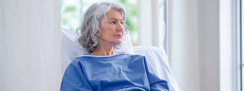 Lady in hospital bed