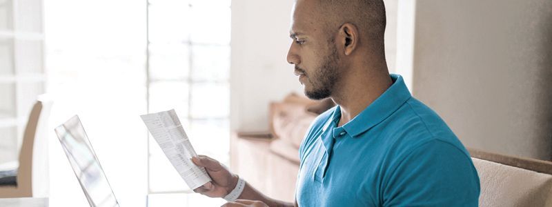 Guy looking at his medical debt and credit report