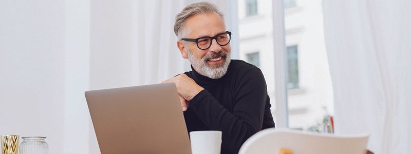 man-smiling-at-computer