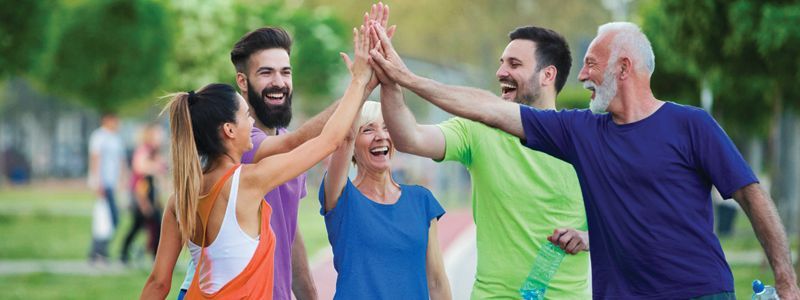 group-of-people-high-fiving-together