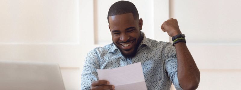 man-excited-reading-paper