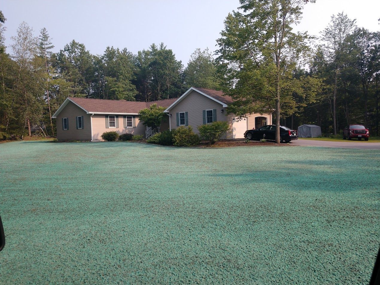 A house with a truck parked in front of it