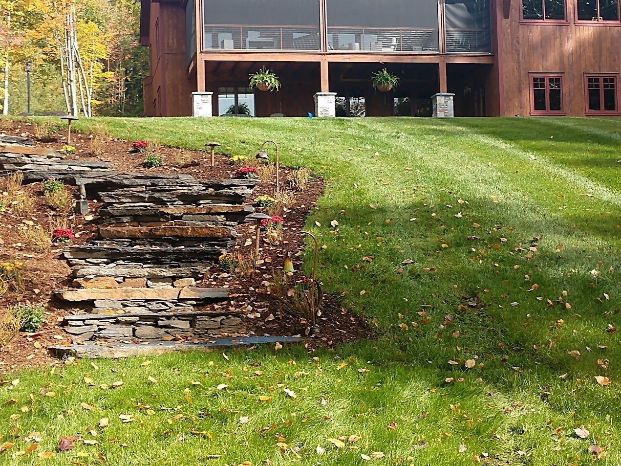 A large house with a large lawn in front of it