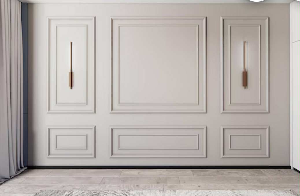 White paneled wall with decorative sconces; a room with gray carpet and curtains.