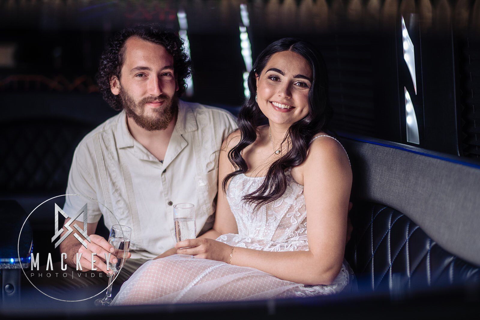 A man and a woman are sitting next to each other in a dark room.