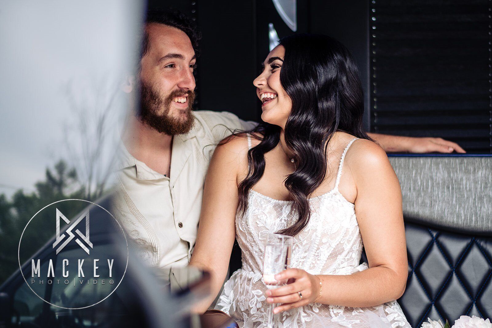 A man and a woman are sitting at a table looking at each other.
