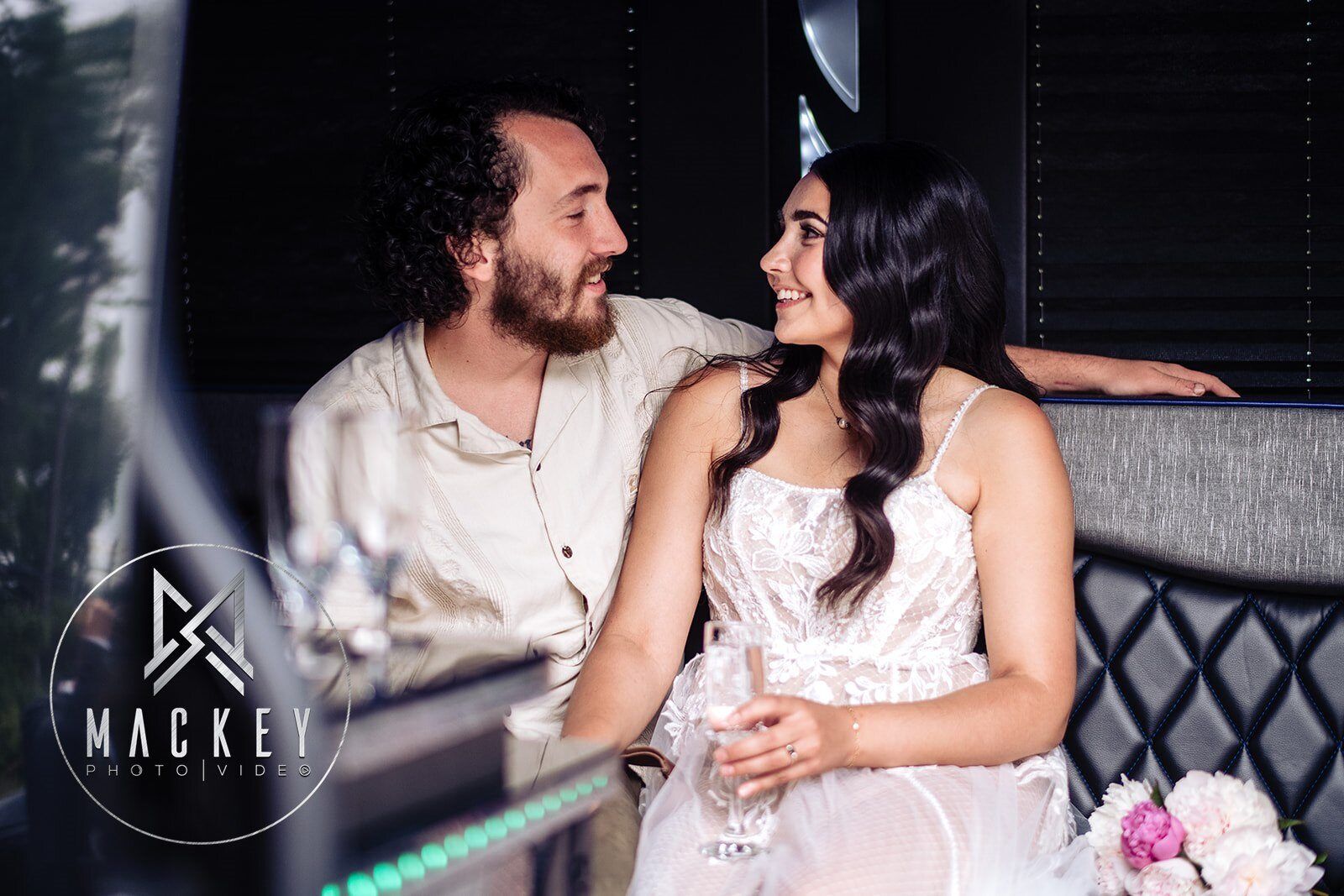 A man and a woman are sitting next to each other and looking at each other.