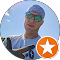 A man wearing sunglasses and a hat is in a circle with an orange star.