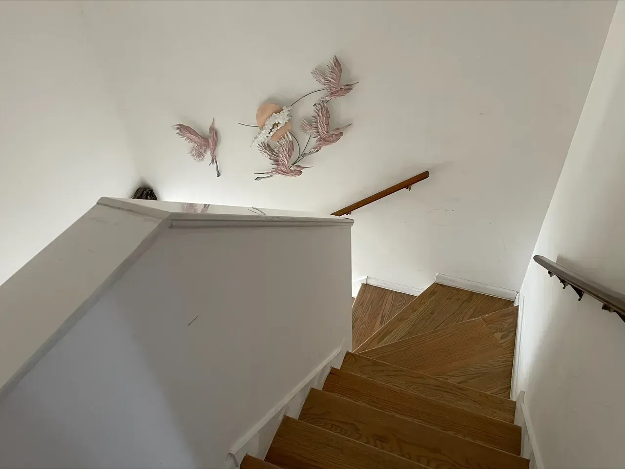 A wooden staircase leading up to the second floor of a house.