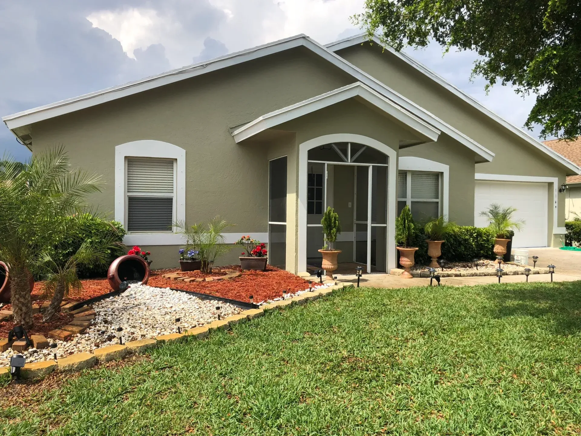 A house with a large lawn in front of it