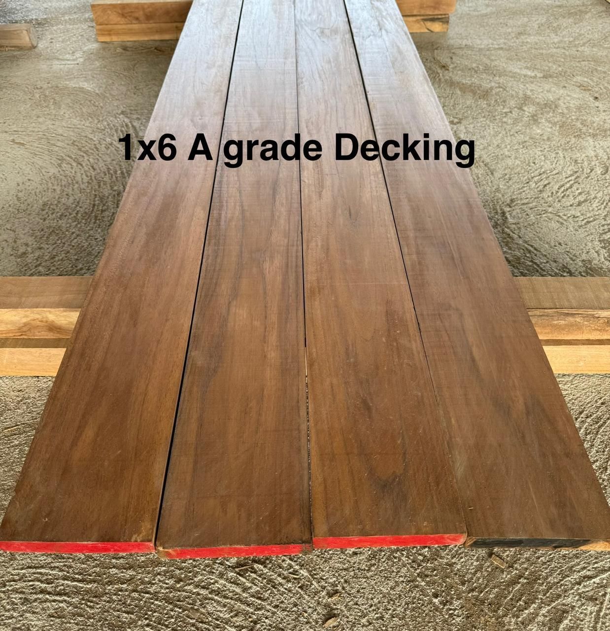 Four A-grade 1x6 wooden decking planks. Brown planks rest on supports, edges marked with red.