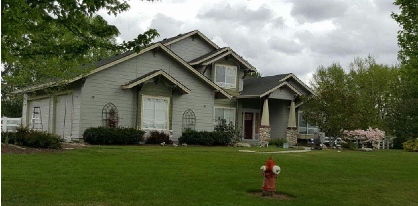 A large house with a garage and a driveway