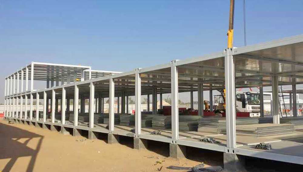 A large building is being built with a crane in the background.