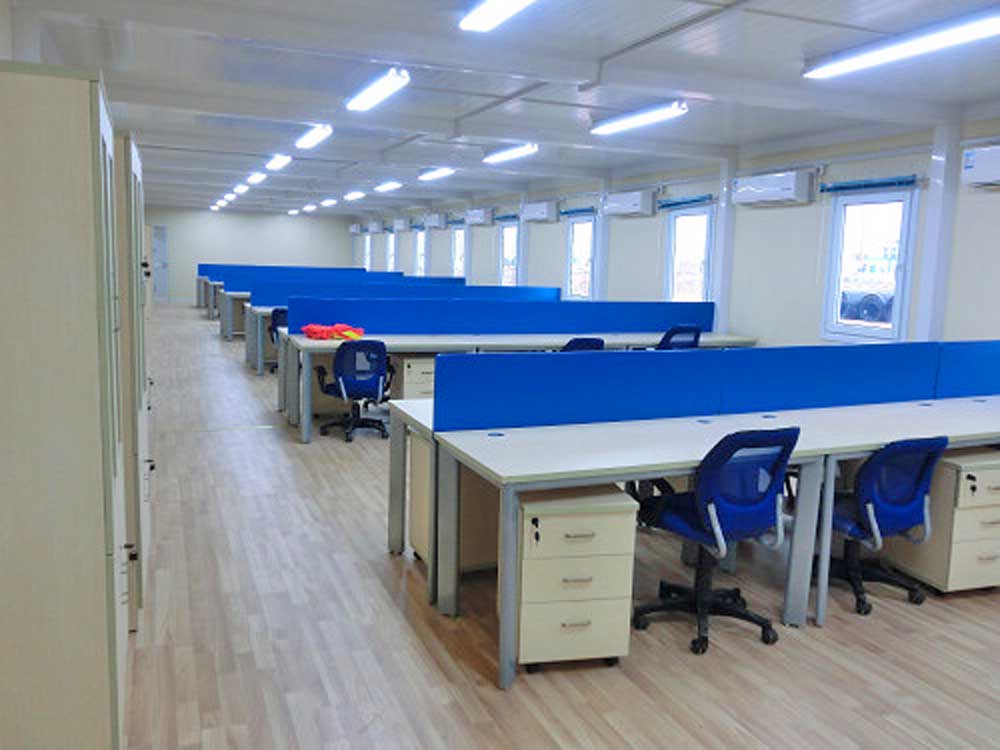 A large office with a lot of desks and chairs