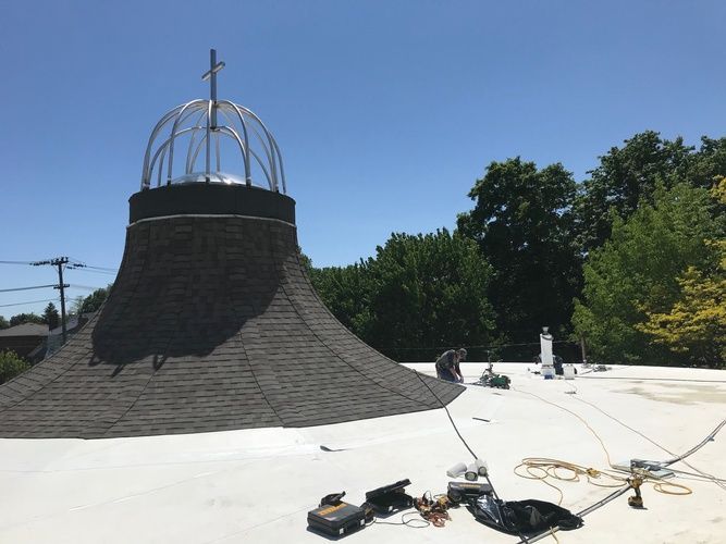 A roof with a large dome on top of it
