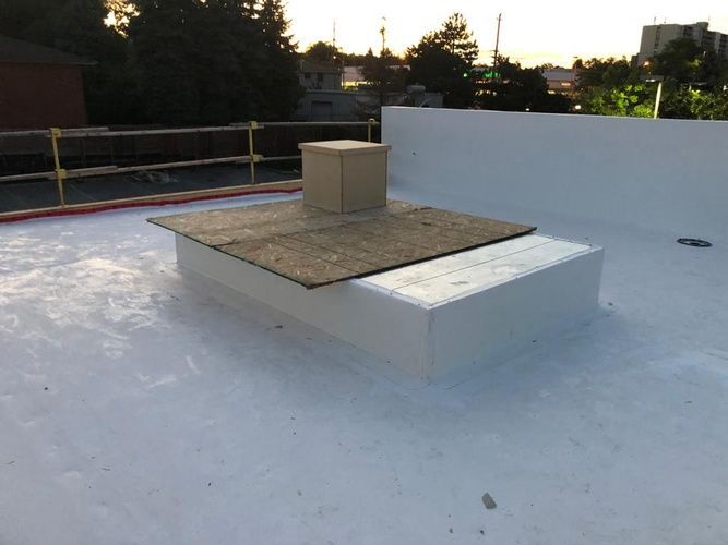 A white roof with a box on top of it