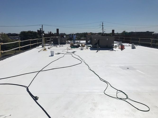 A white roof with a black cord on it