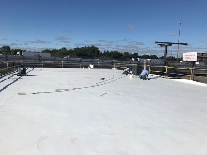 A white roof with a blue sky in the background.