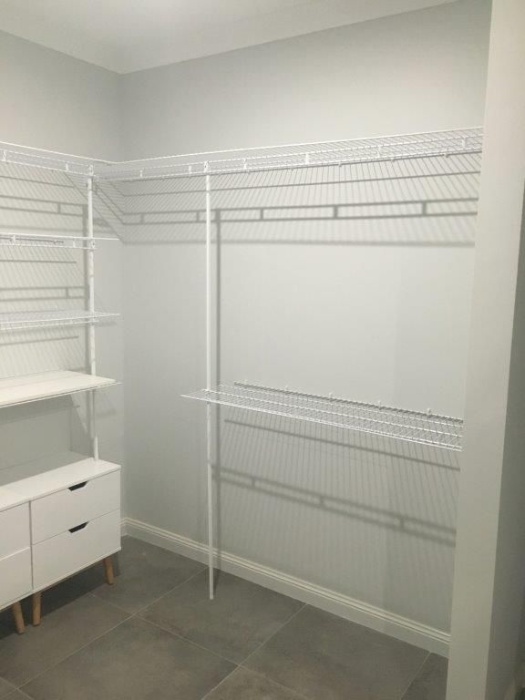 A Walk In Closet With White Wire Shelves And Drawers — MRS–Mirrors, Robes & Shower Screens In Yarrawonga, NT