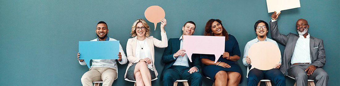 people holding chat bubbles and smiling
